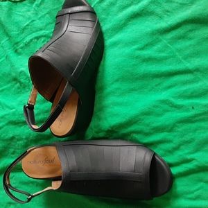 Black, open toe shoes with adjustable velcro straps in back